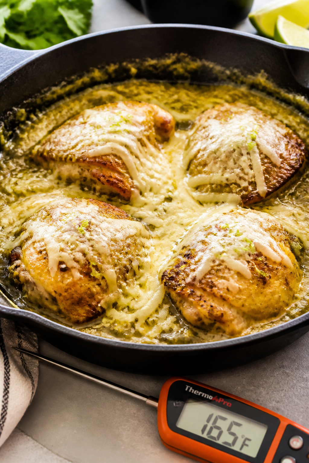 Cooking process: Mid-bake reveal of the dish after foil is removed—chicken nestled in a bed of sal