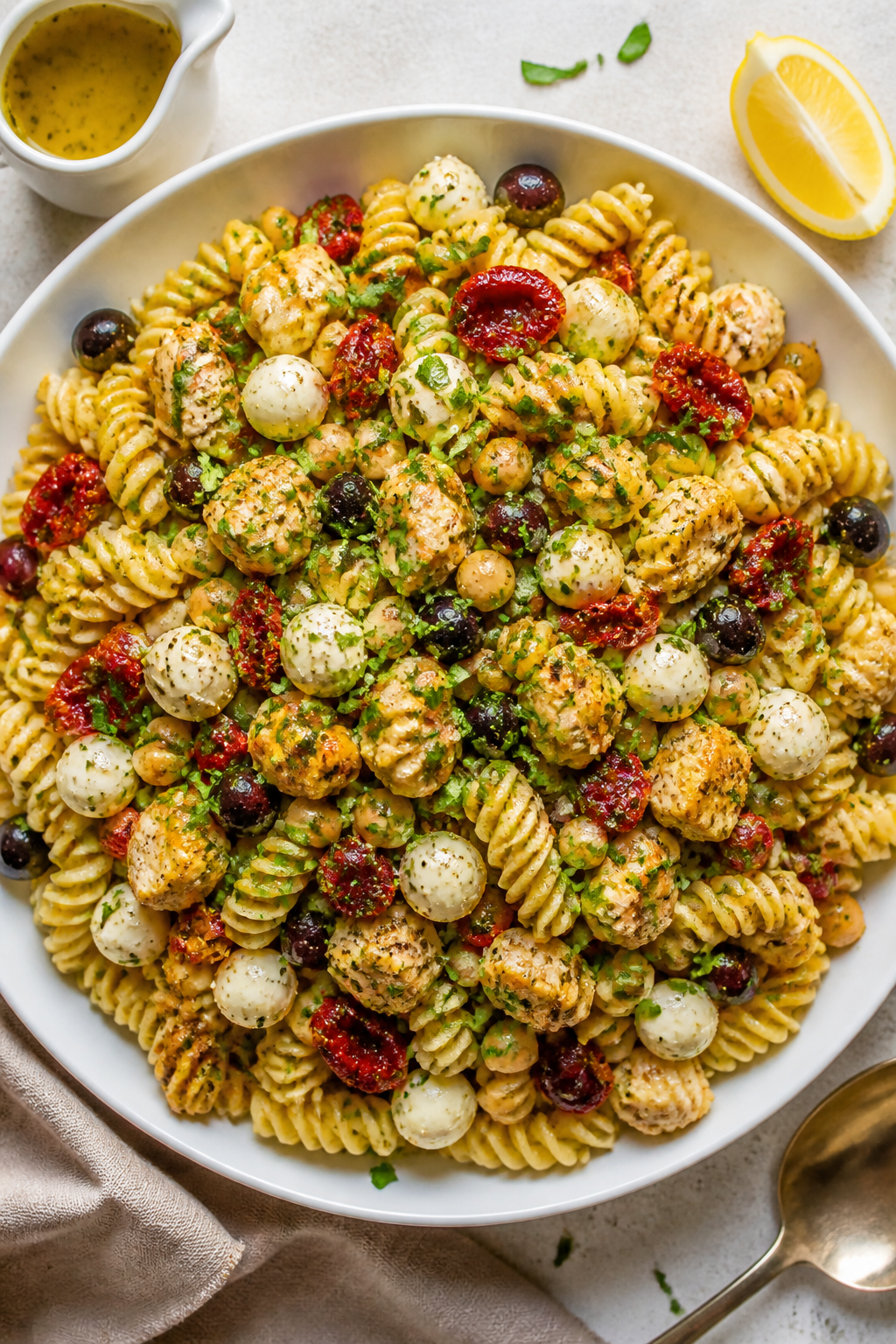 Overhead “tasty top view” of the final High Protein Loaded Italian Pasta Salad in a large white