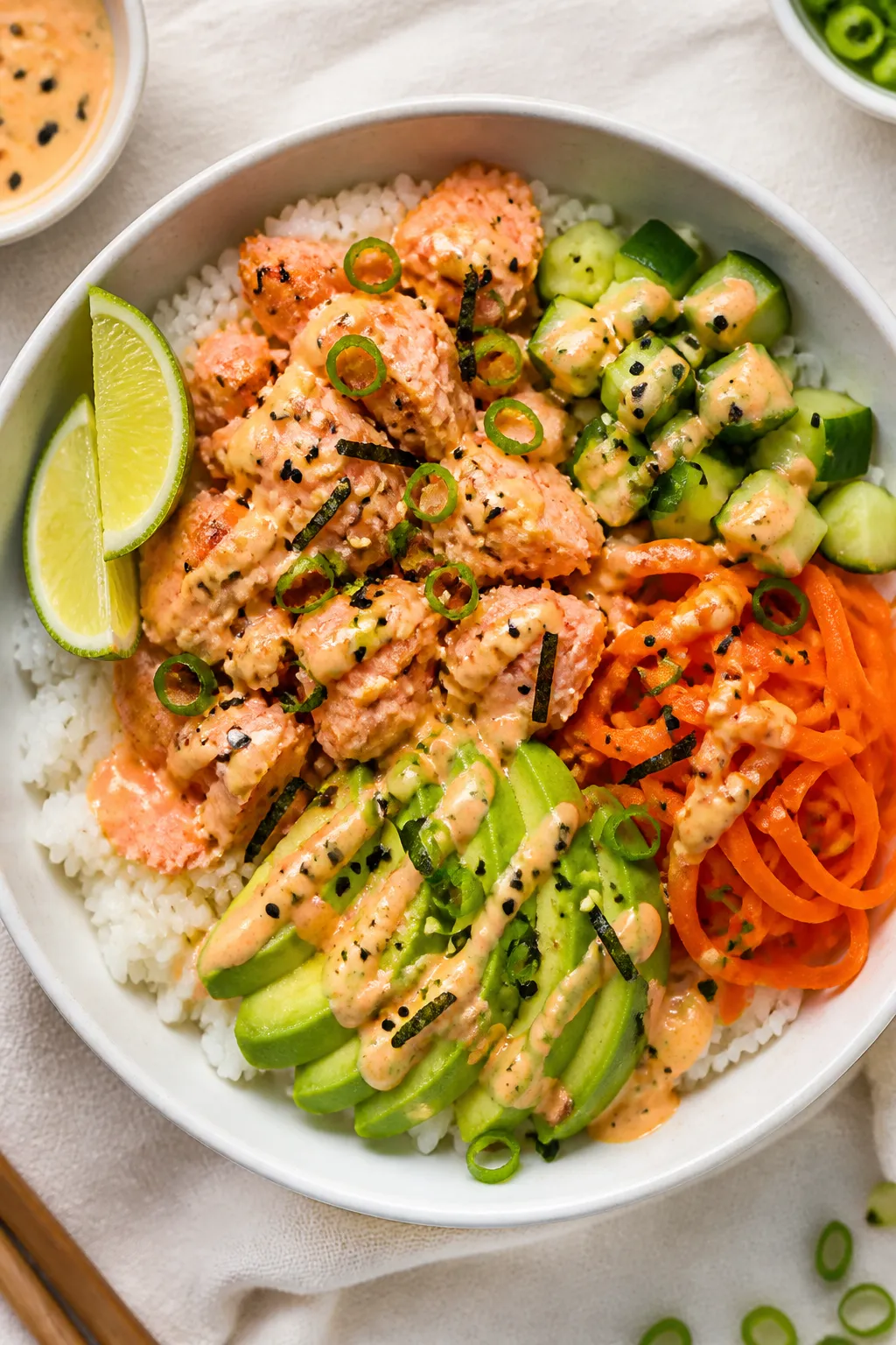 Tasty top view: Overhead shot of assembled High Protein Salmon Rice Bowls—fluffy jasmine rice base