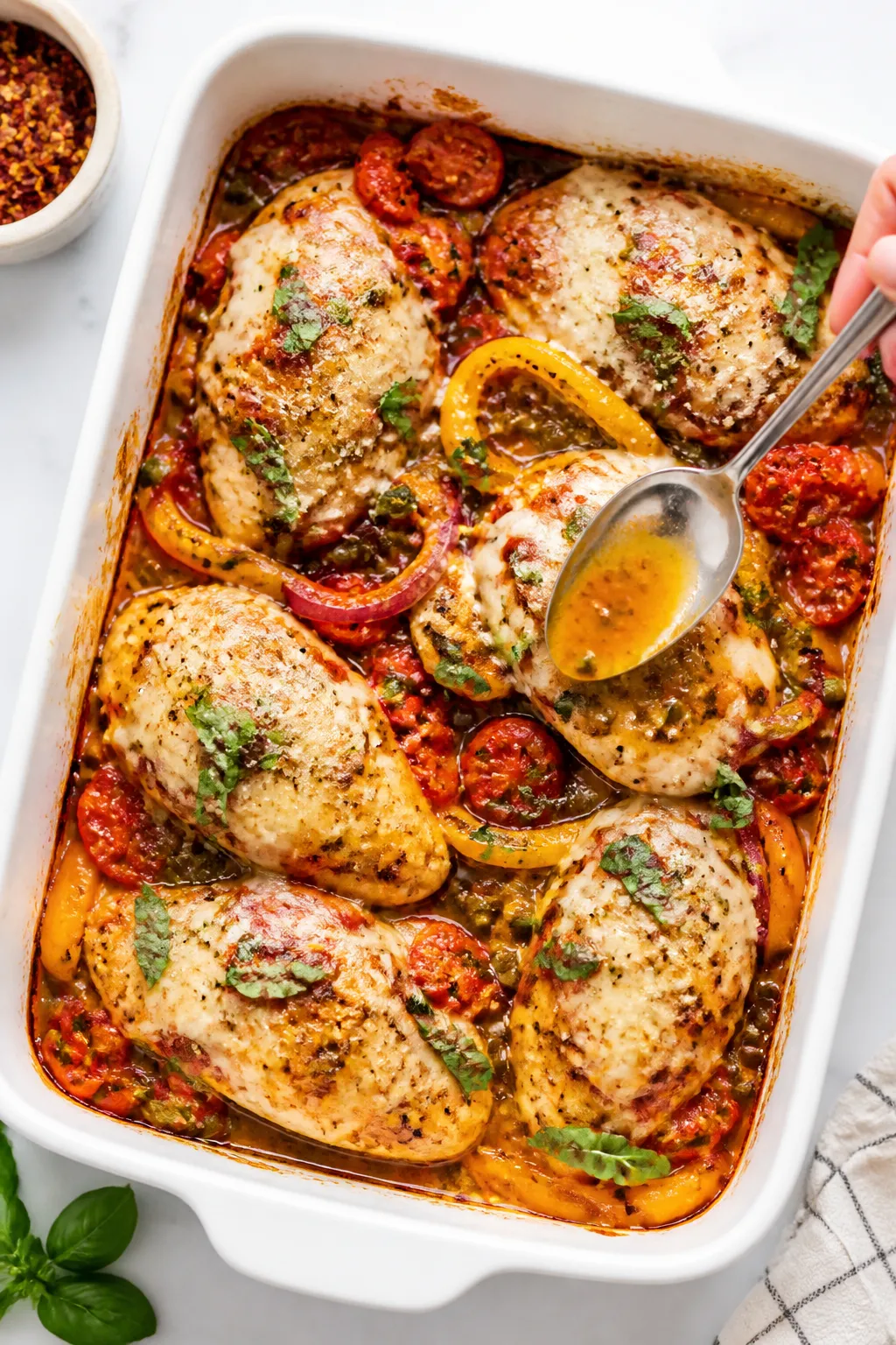 Tasty top view: Overhead shot of the Healthy Italian Chicken Bake in a 9x13 white baking dish right